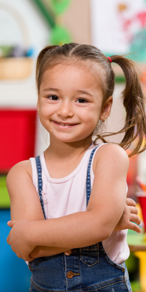 young girl student with pony tails smiling to camera